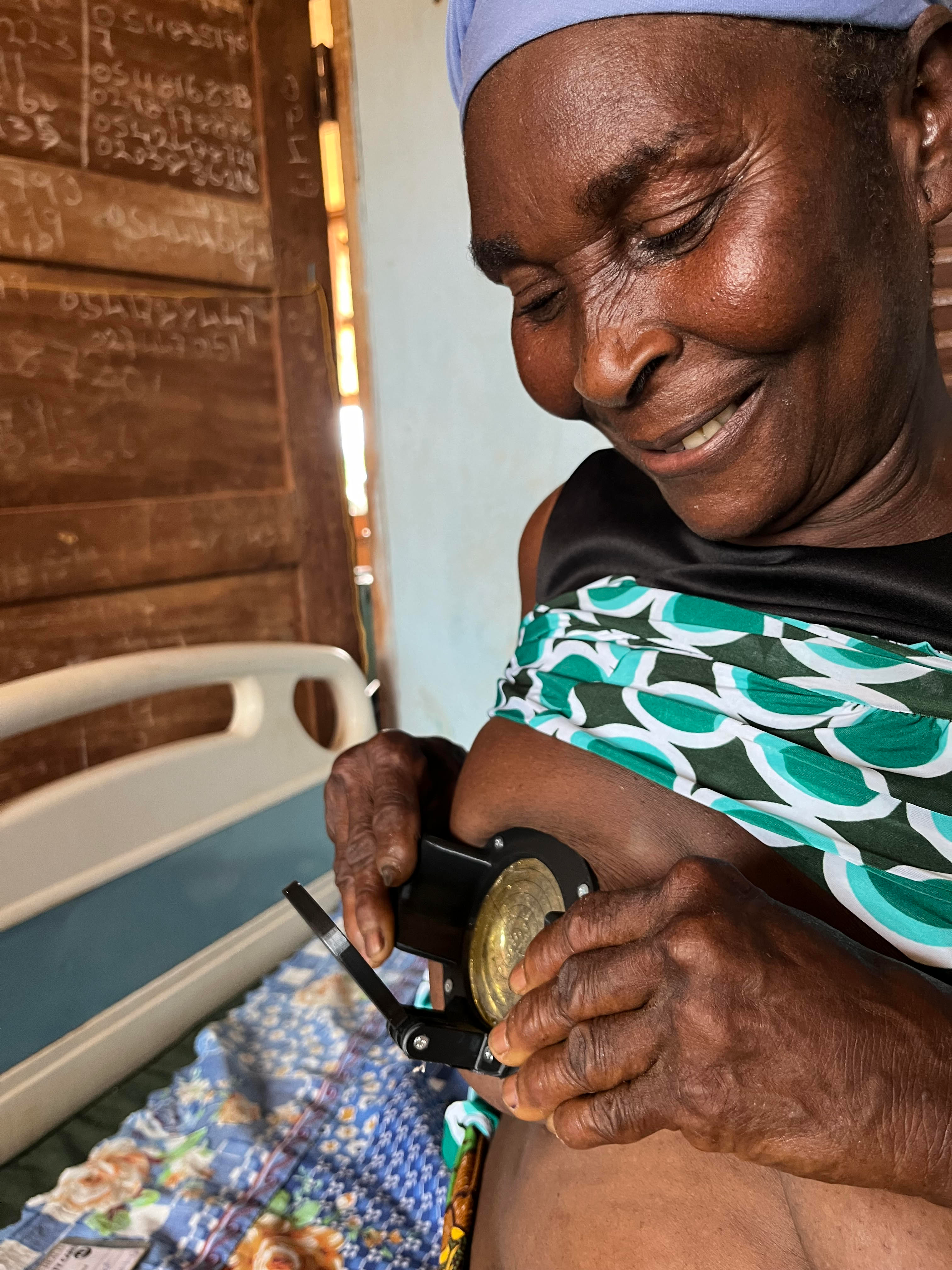 Patient receiving breast examination with MiraScope® device in Ghana clinic